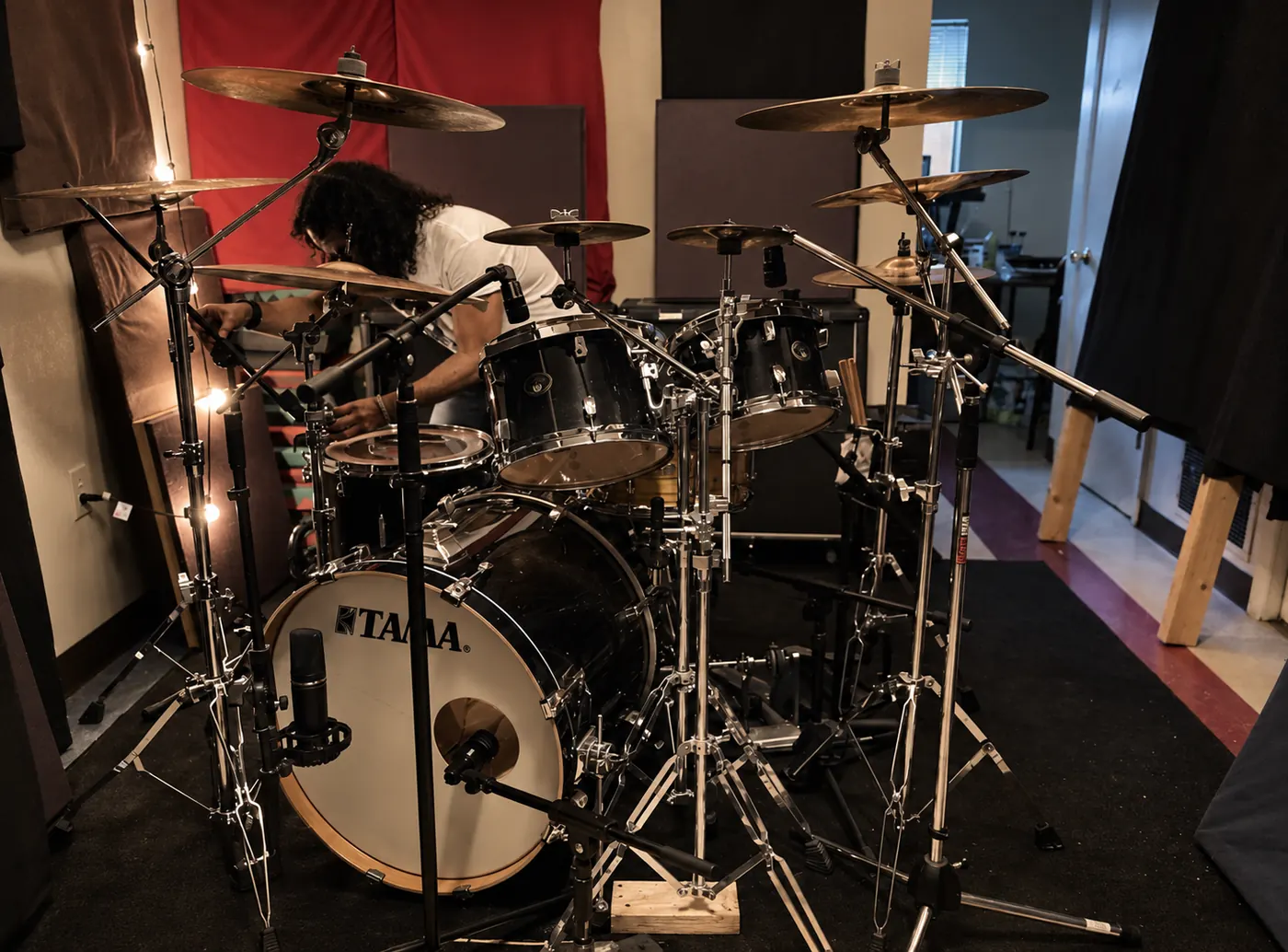 Tama kit with kick and overhead microphones in position.