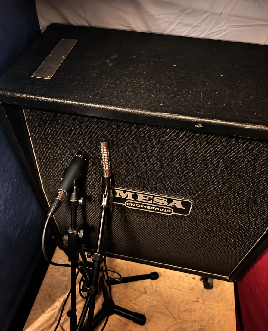 Two microphones on a Mesa Engineering guitar cabinet.